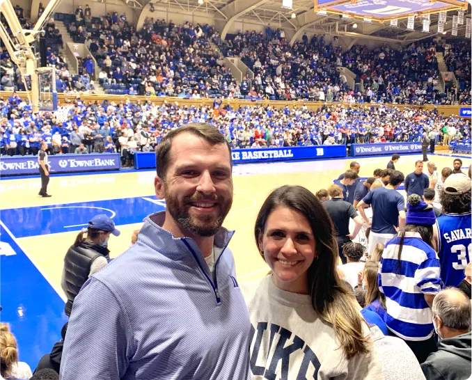 Matt Ostrowski and his wife at a Duke basketball game